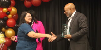Cedar Hill ISD Announces District, STEM Teachers of the Year Davie Moore shaking hands with CHISD Superintendent