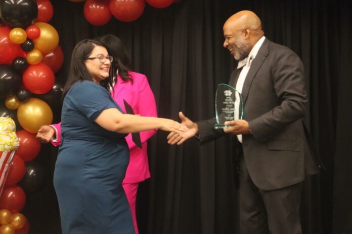 Davie Moore shaking hands with CHISD Superintendent