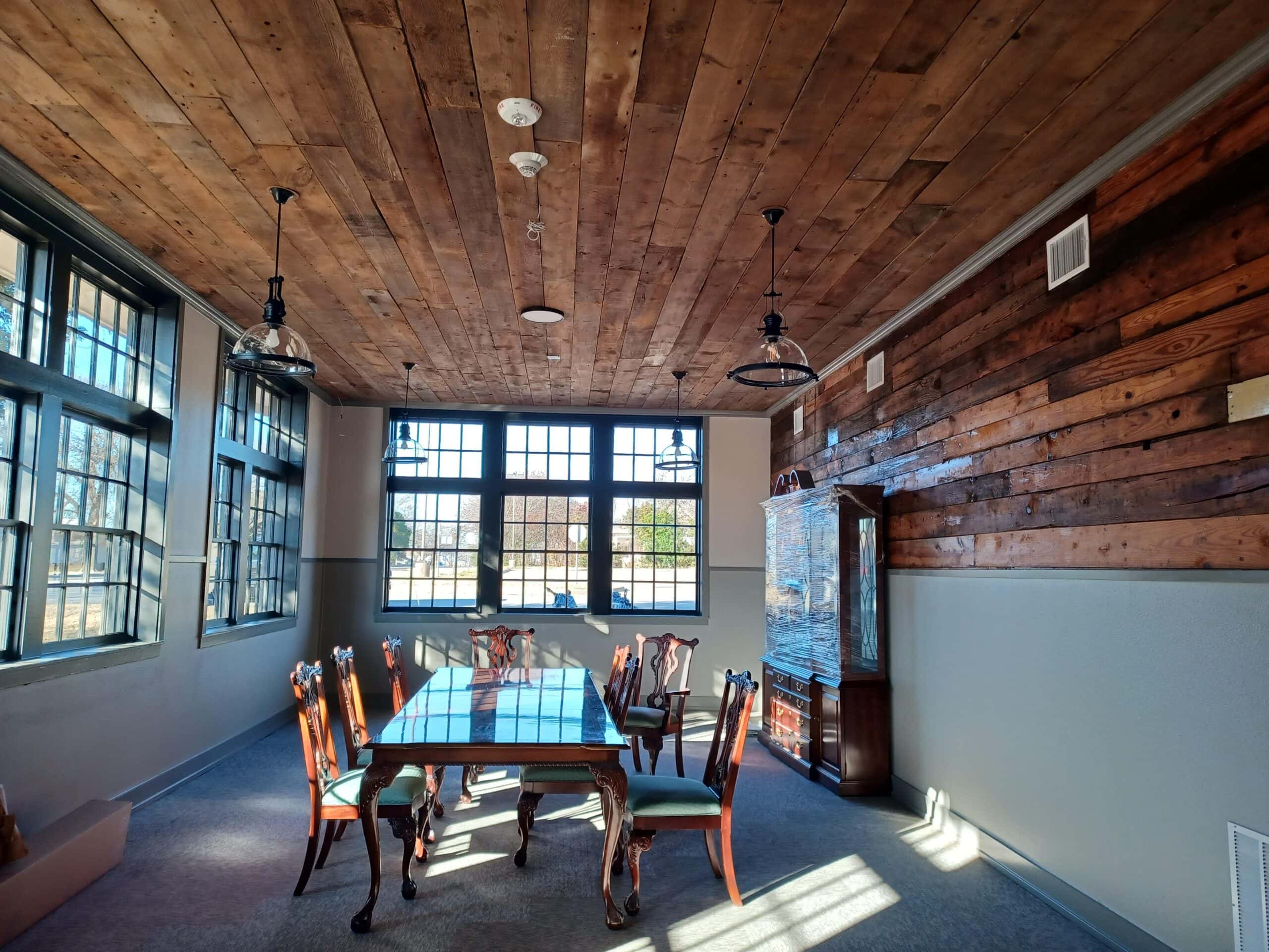 room with wood ceiling and dining table