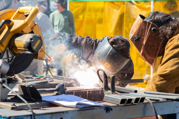 students welding