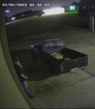 video cam photo of truck with white male