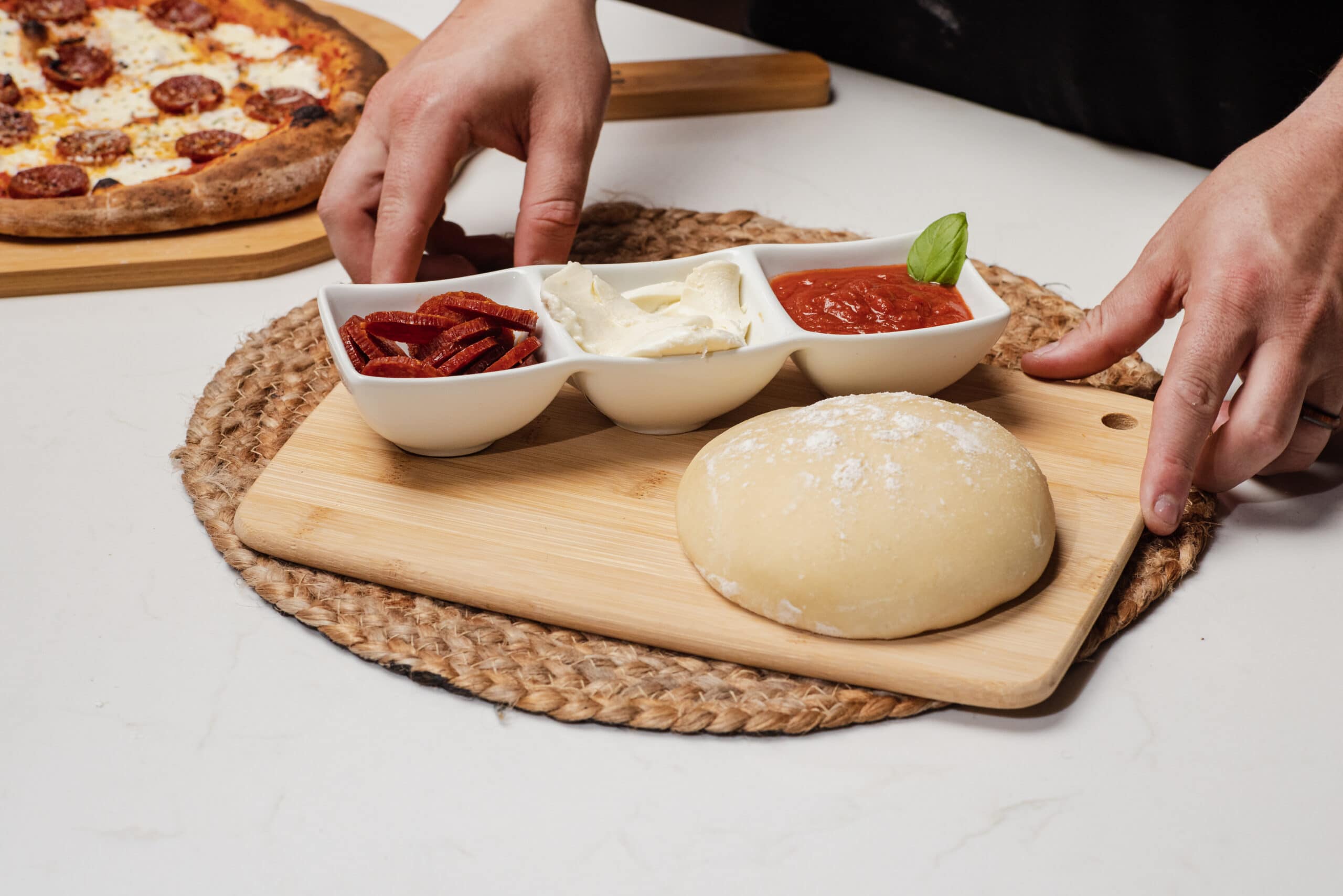 pizza dough with pepperoni and cheese