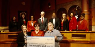 Trinity Church Donates $10,000 to Cedar Hill ISD’s Chip In Program men and women holding cardboard check