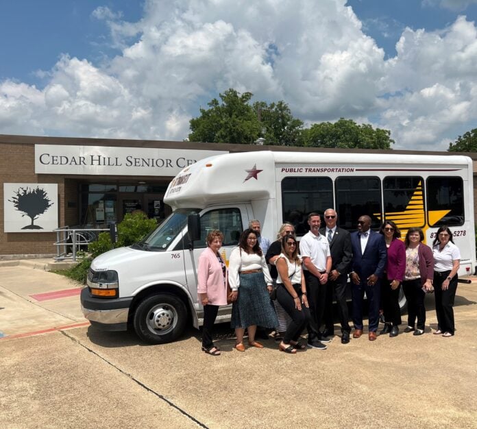 STAR Transit vehicle and Cedar Hill officials