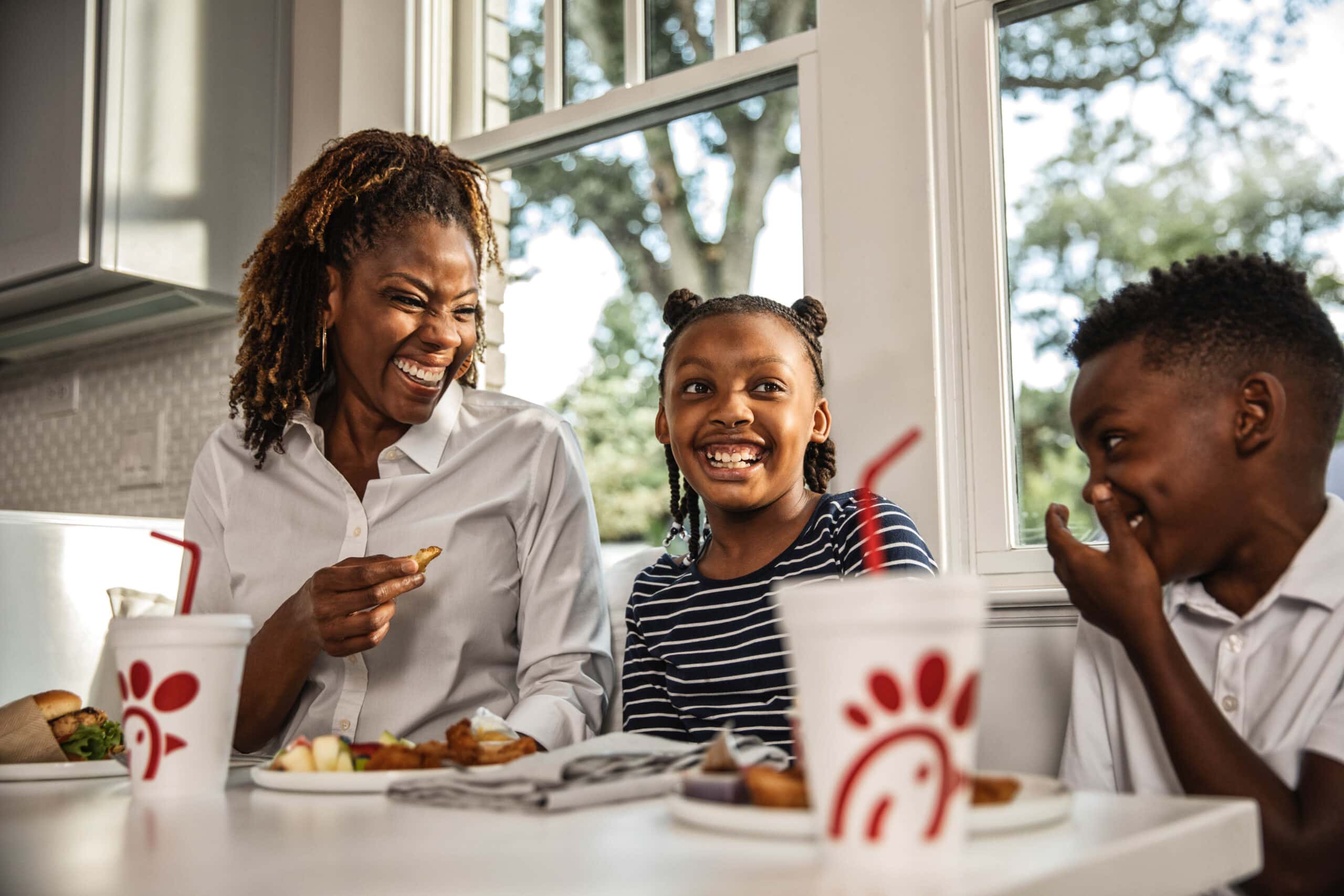 mom with kids eating chick-fil-a