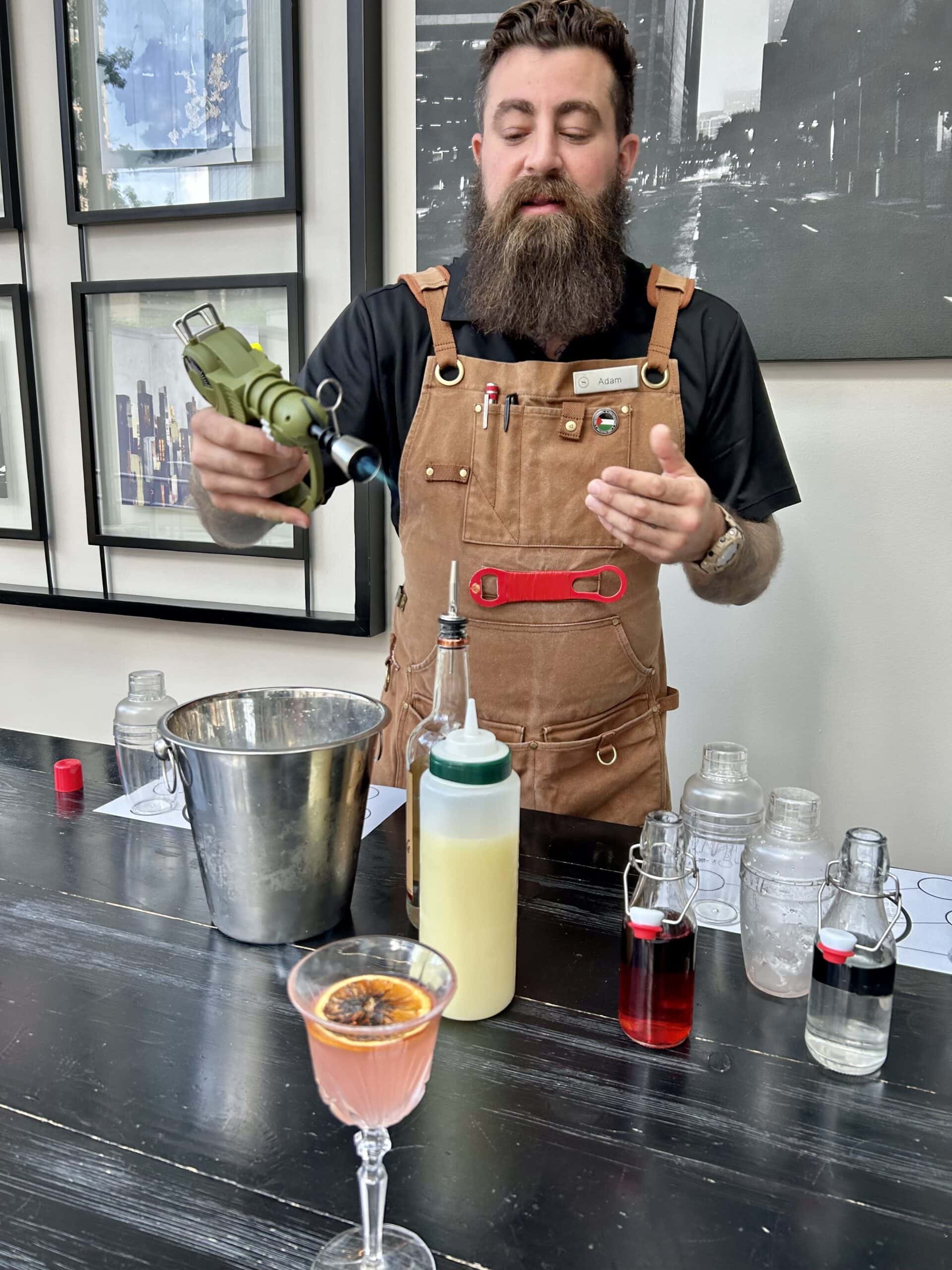 bartender with ingredients for cosmopolitan