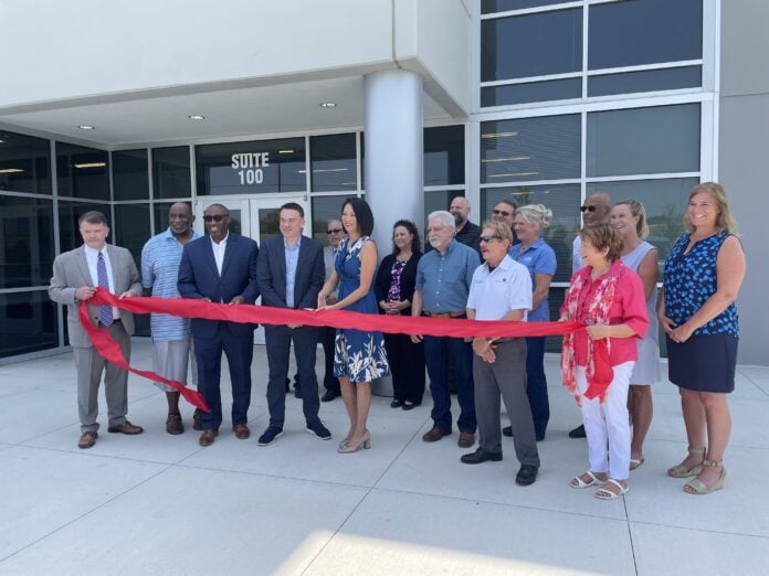 group of people at WAC Dallas ribbon cutting