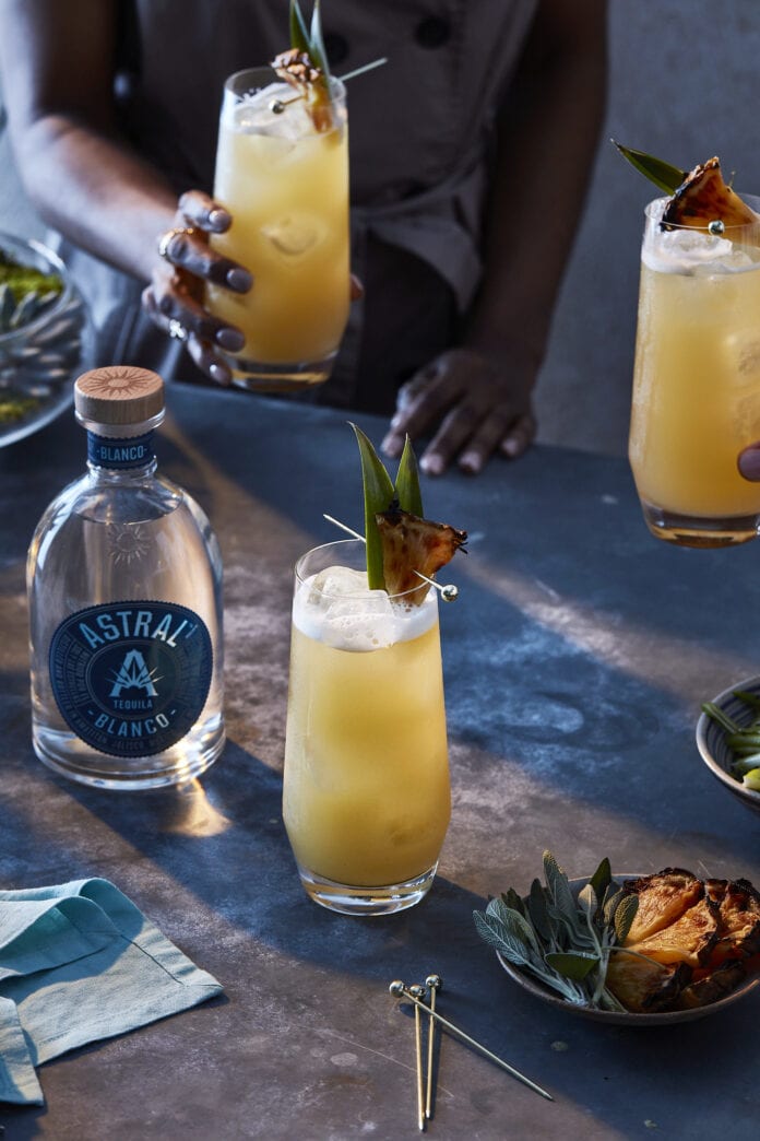 Pineapple cocktail with astral tequila bottle