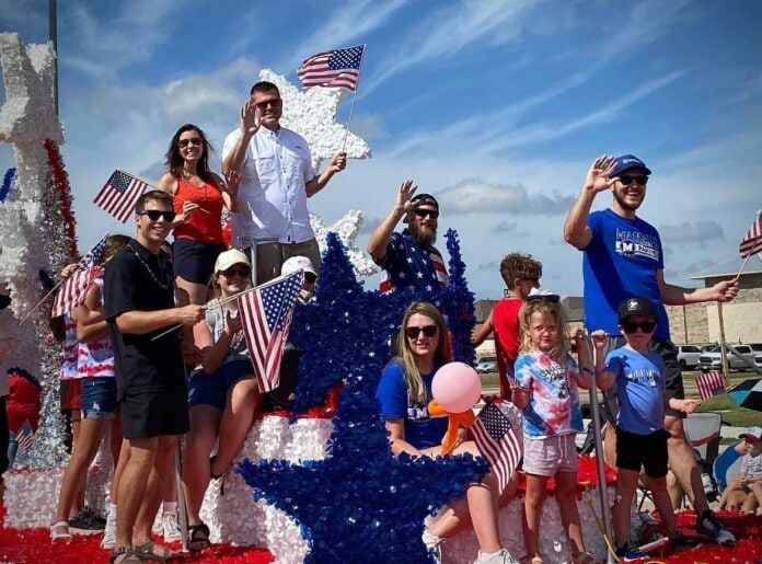 Midlothian City Council members and family on 4th of July float