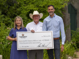 Nancy and Dan Garrison with cardboard check