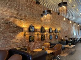 old brick wall with chairs