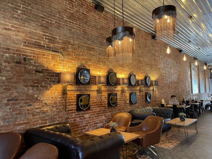 old brick wall with chairs