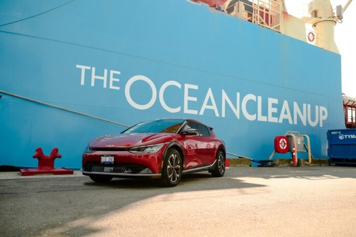 Kia in front of The Ocean Cleanup wall