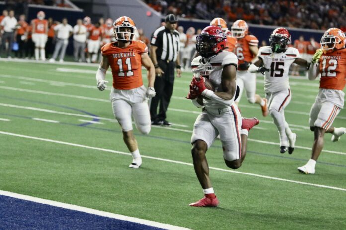 Cedar Hill football player running