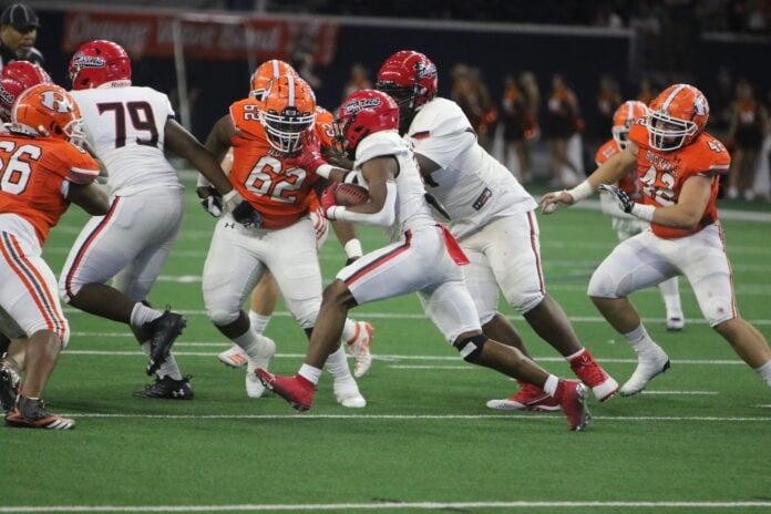 Cedar Hill football players action shot