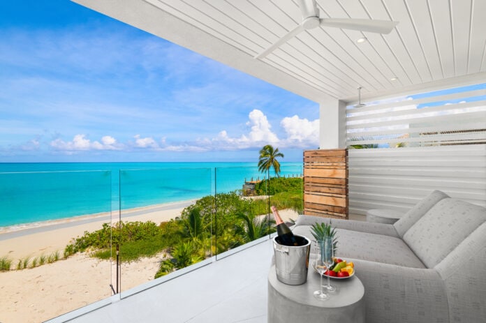 balcony overlooking beach with champagne