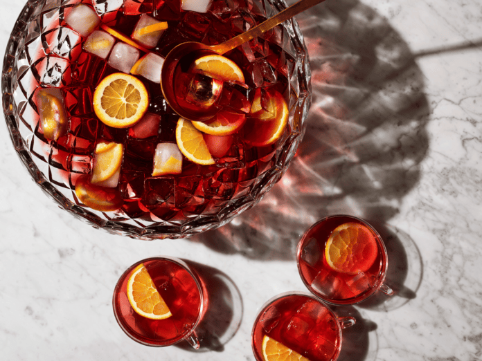 punch bowl with punch and cocktail glasses
