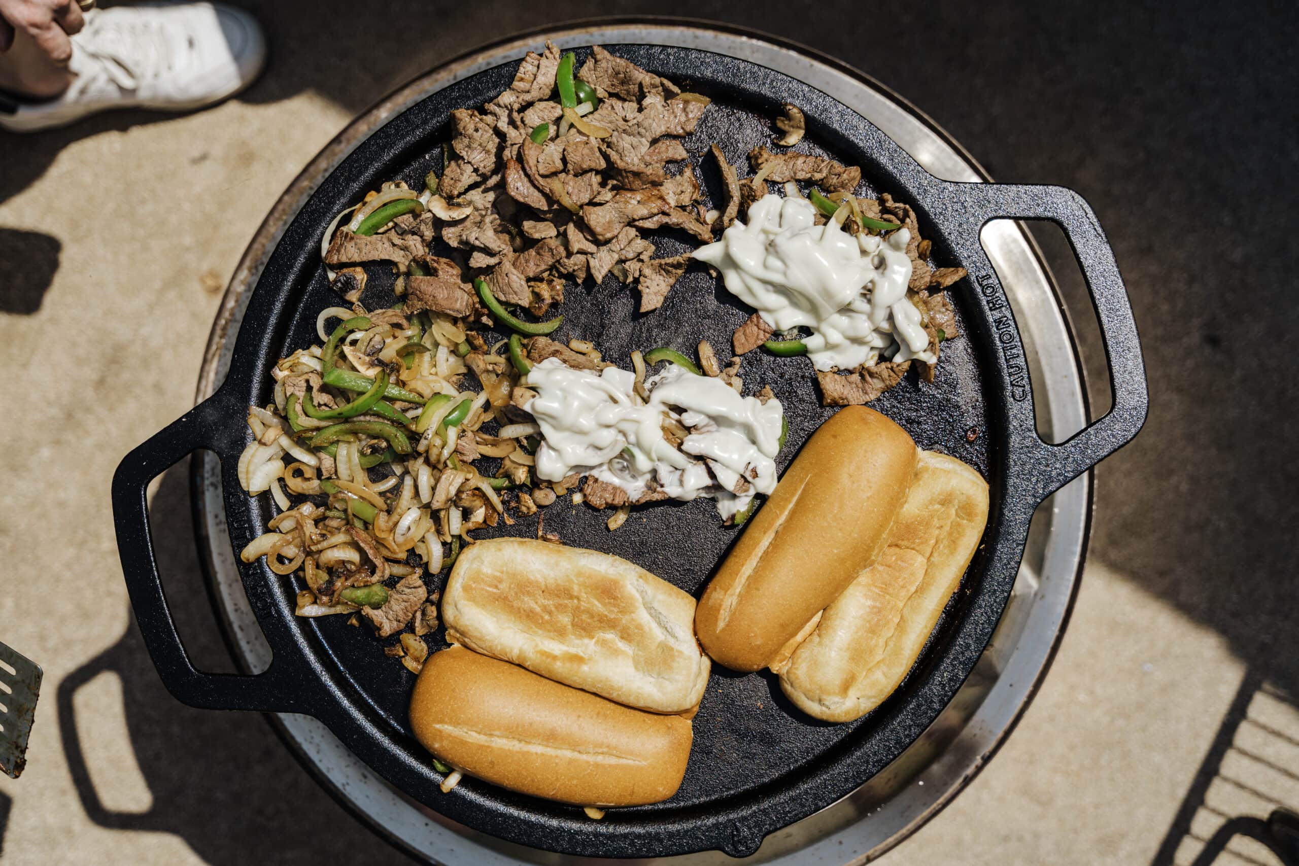 griddle with steak cheese and peppers