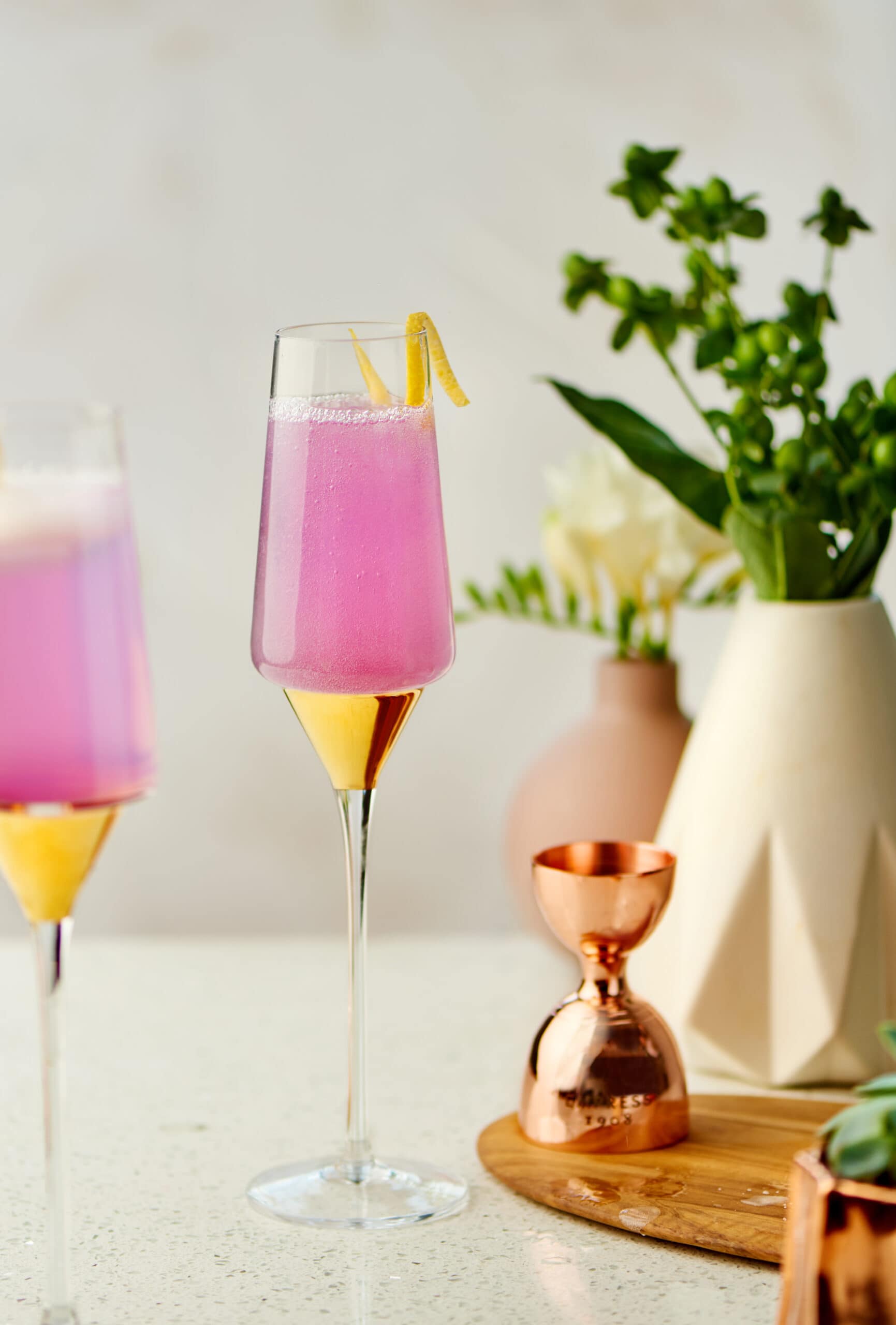 pink colored cocktail in champagne glass