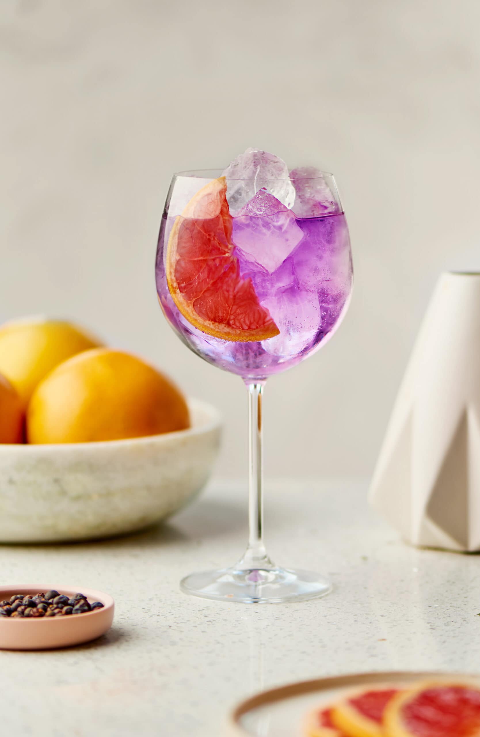 lavender colored gin and tonic in wine glass