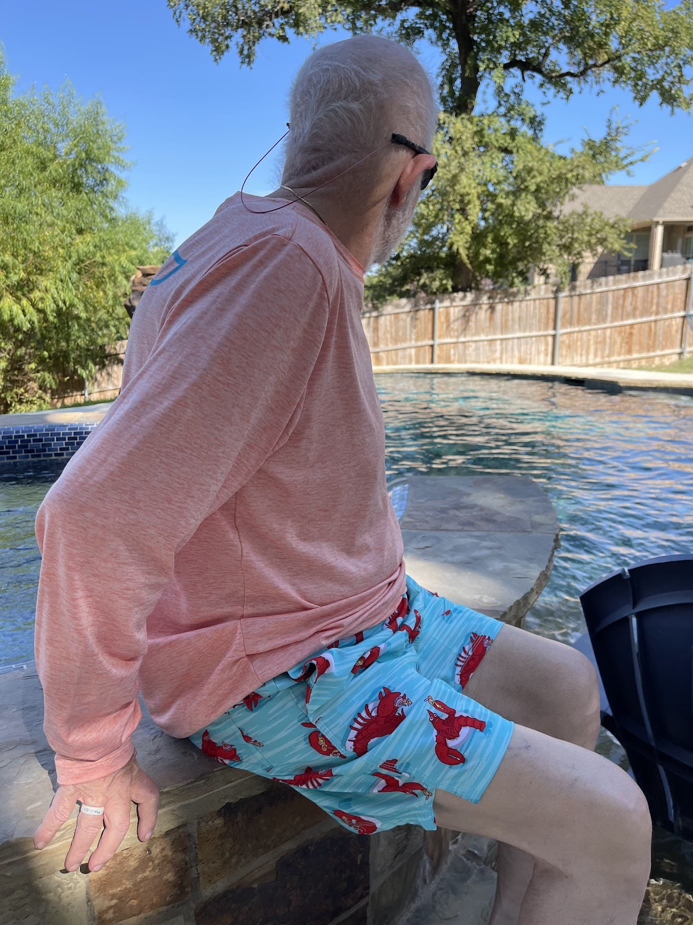 man wearing lobster swim trunks