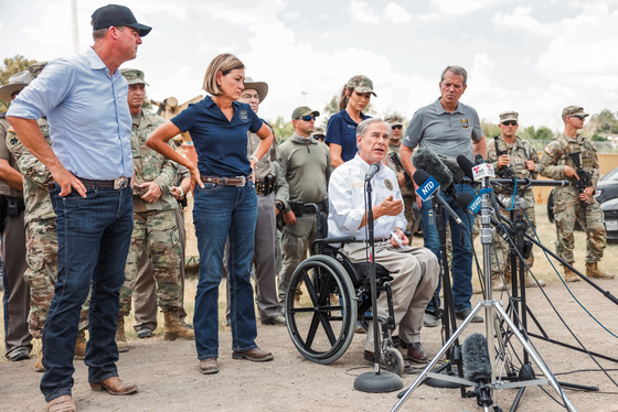 Governor Abbott with officials at border