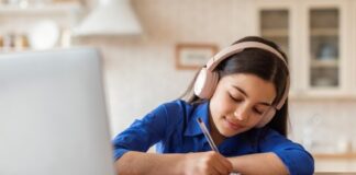 Tuition-free Virtual Public Schools Ready To Welcome Texas Students Back To School girl wearing headphones by laptop