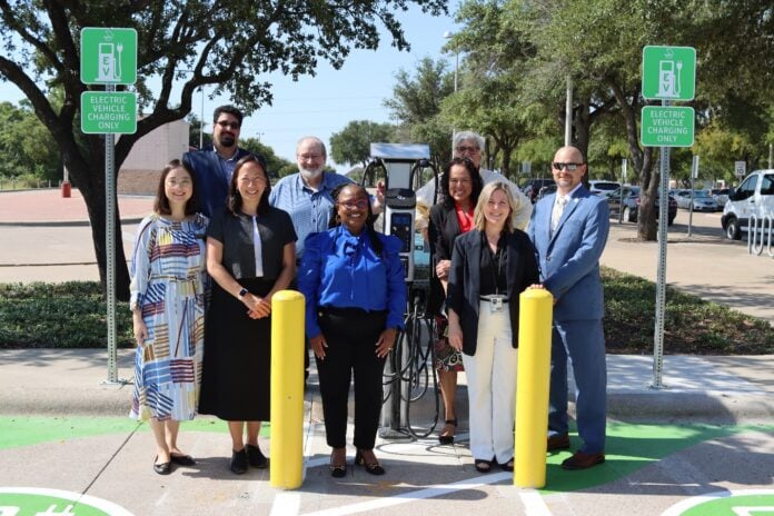 DART officials at electric vehicle charging station