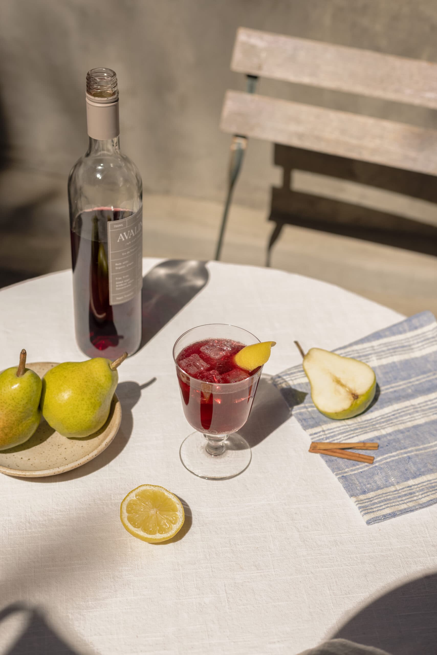 bottle of wine and cocktail with pears