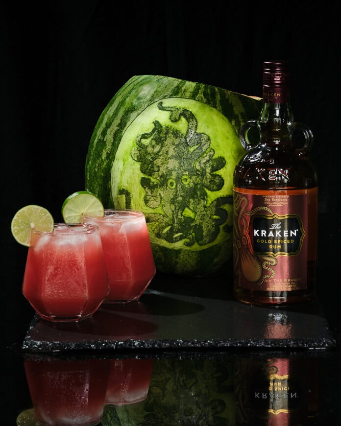 watermelon with Kraken gold rum bottle