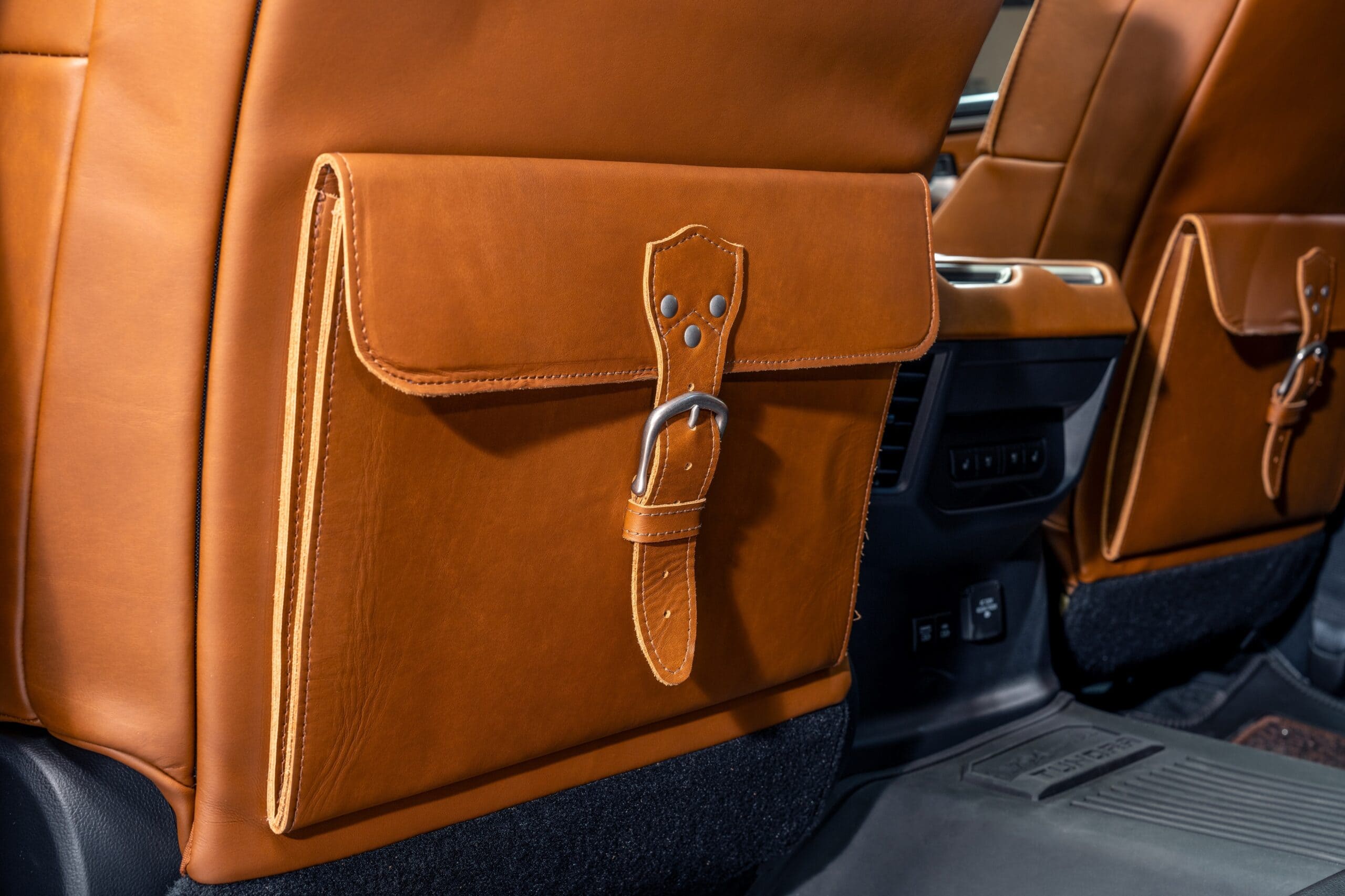 leather bag on back seat of 1794 Tundra