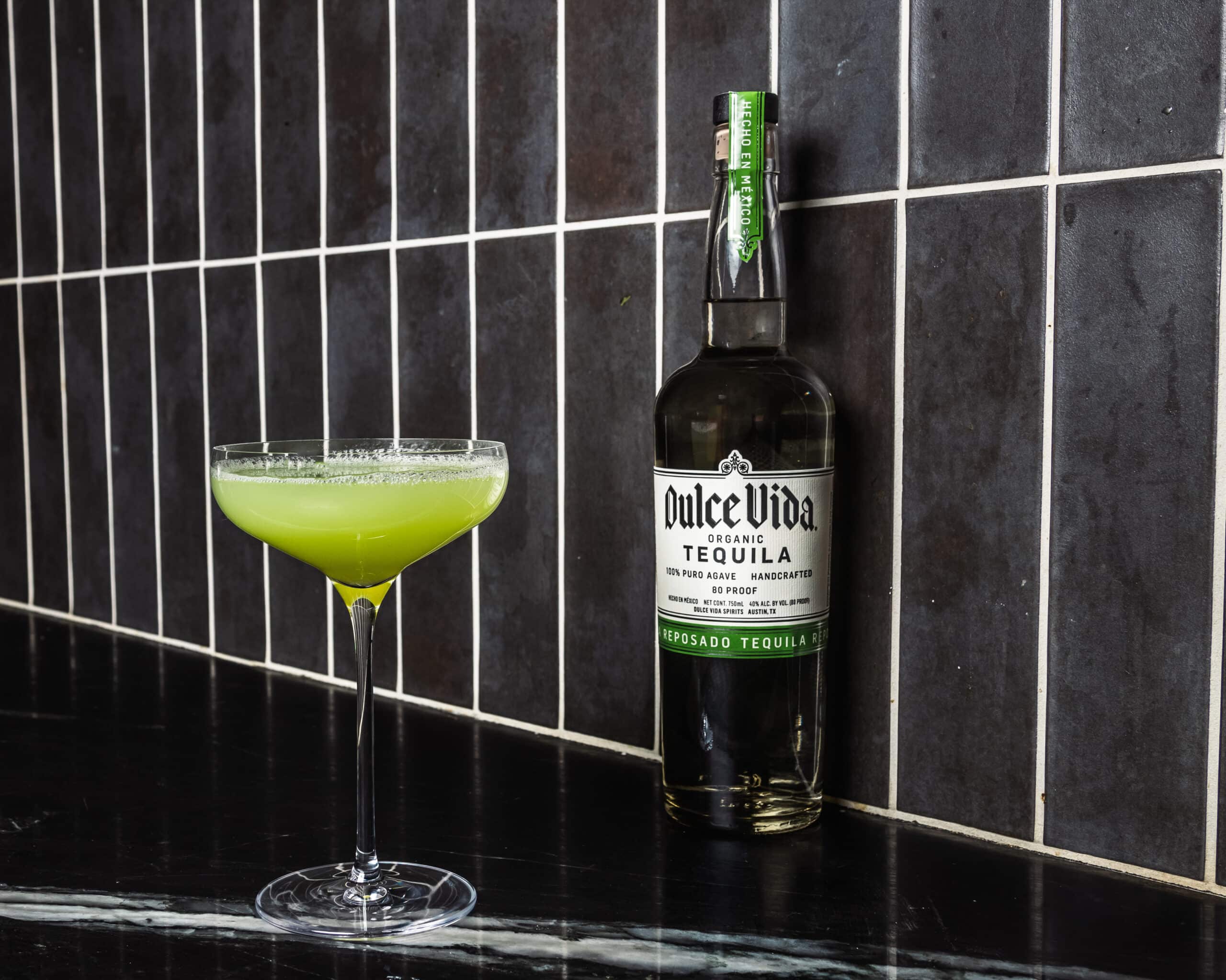 green cocktail with Dulce Vida tequila bottle