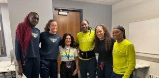 Becky Hennessy with Dallas Wings players