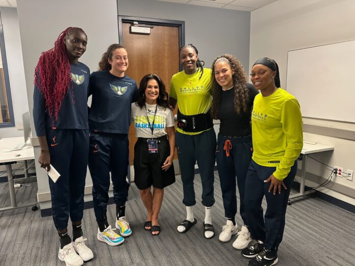 Becky Hennessy with Dallas Wings players