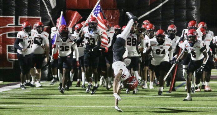 football team running onto field