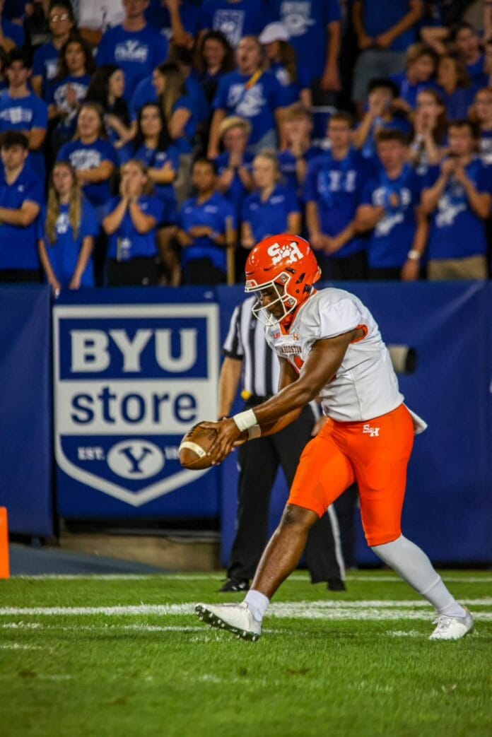 Jadon Cardell kicking football