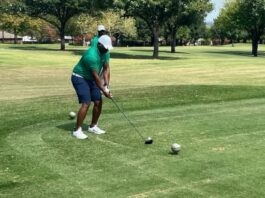 Stephen Mason hitting a golf ball