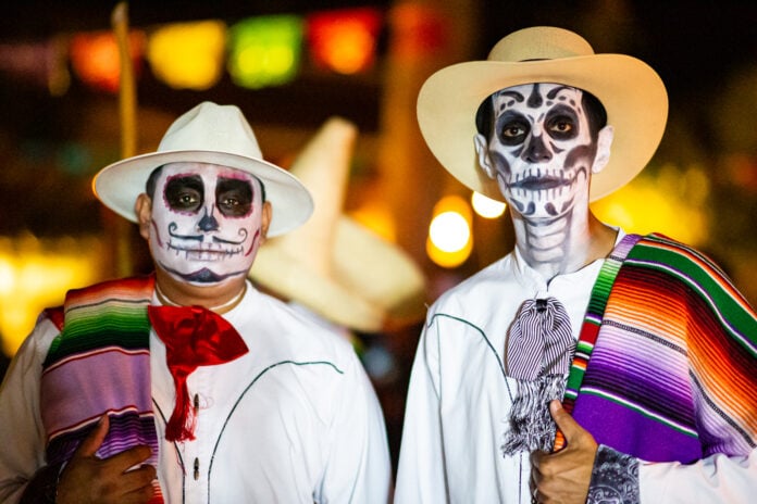 people with Day of the Dead face masks