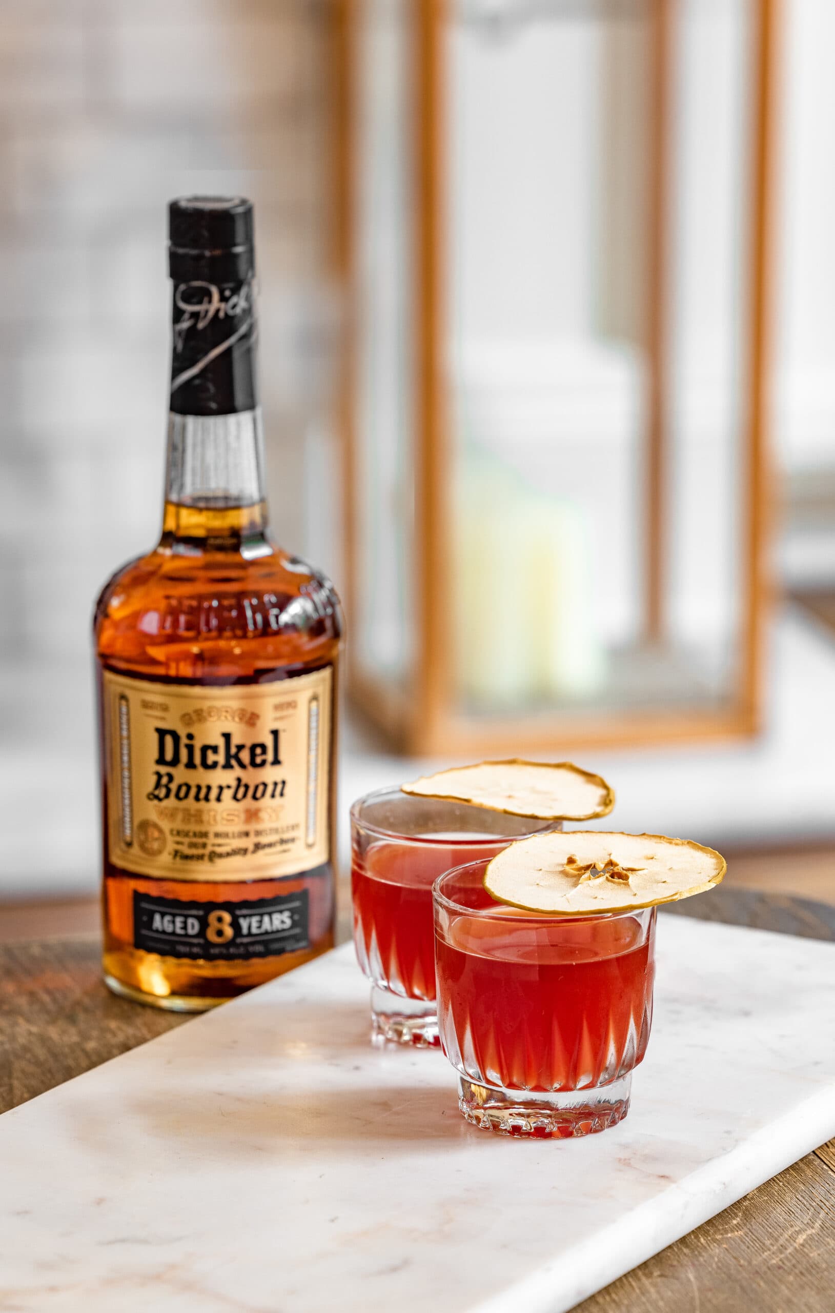 George Dickel bourbon bottle with apple cocktail