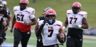 CEDAR HILL FOOTBALL DEFEATS TOMBALL, 28-7, ADVANCES TO STATE QUARTERFINALS Cedar Hill football player