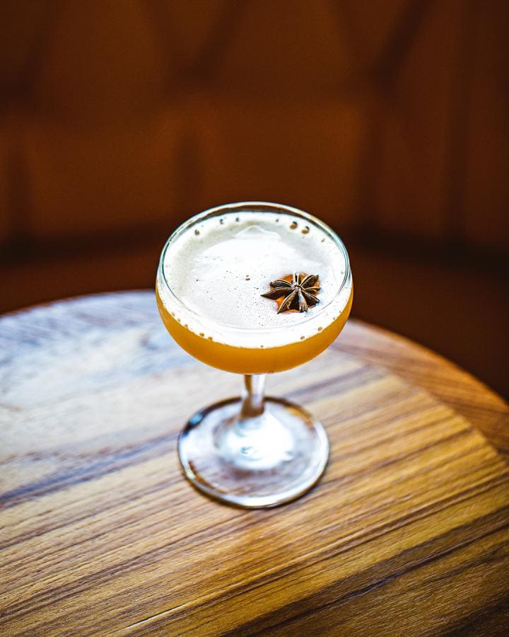 cocktail in coupe glass with star anise