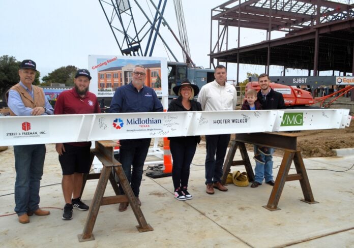 Current members of Midlothian’s City Council attended the beam-signing event. From left are: Mike Rodgers, Place 2, Allen Moorman, Place 1, Ed Gardner, Place 5, Anna Hammonds, Place 3, Justin Coffman, mayor, and Clark Wickliffe, mayor pro tem with son Leland.