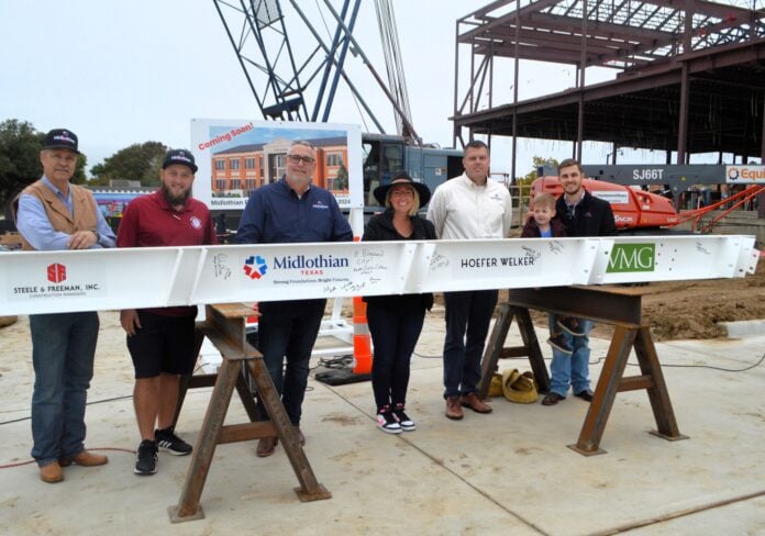 City Council Current members of Midlothian’s City Council attended the beam-signing event. From left are: Mike Rodgers, Place 2, Allen Moorman, Place 1, Ed Gardner, Place 5, Anna Hammonds, Place 3, Justin Coffman, mayor, and Clark Wickliffe, mayor pro tem with son Leland.