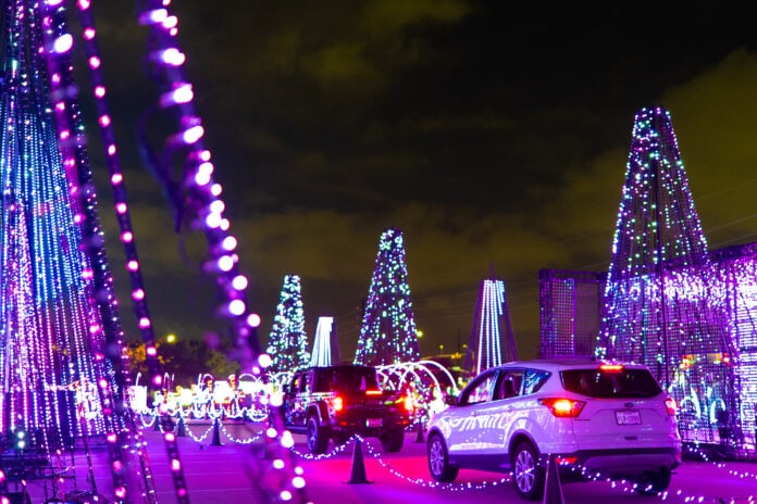 cars going through Holiday light park