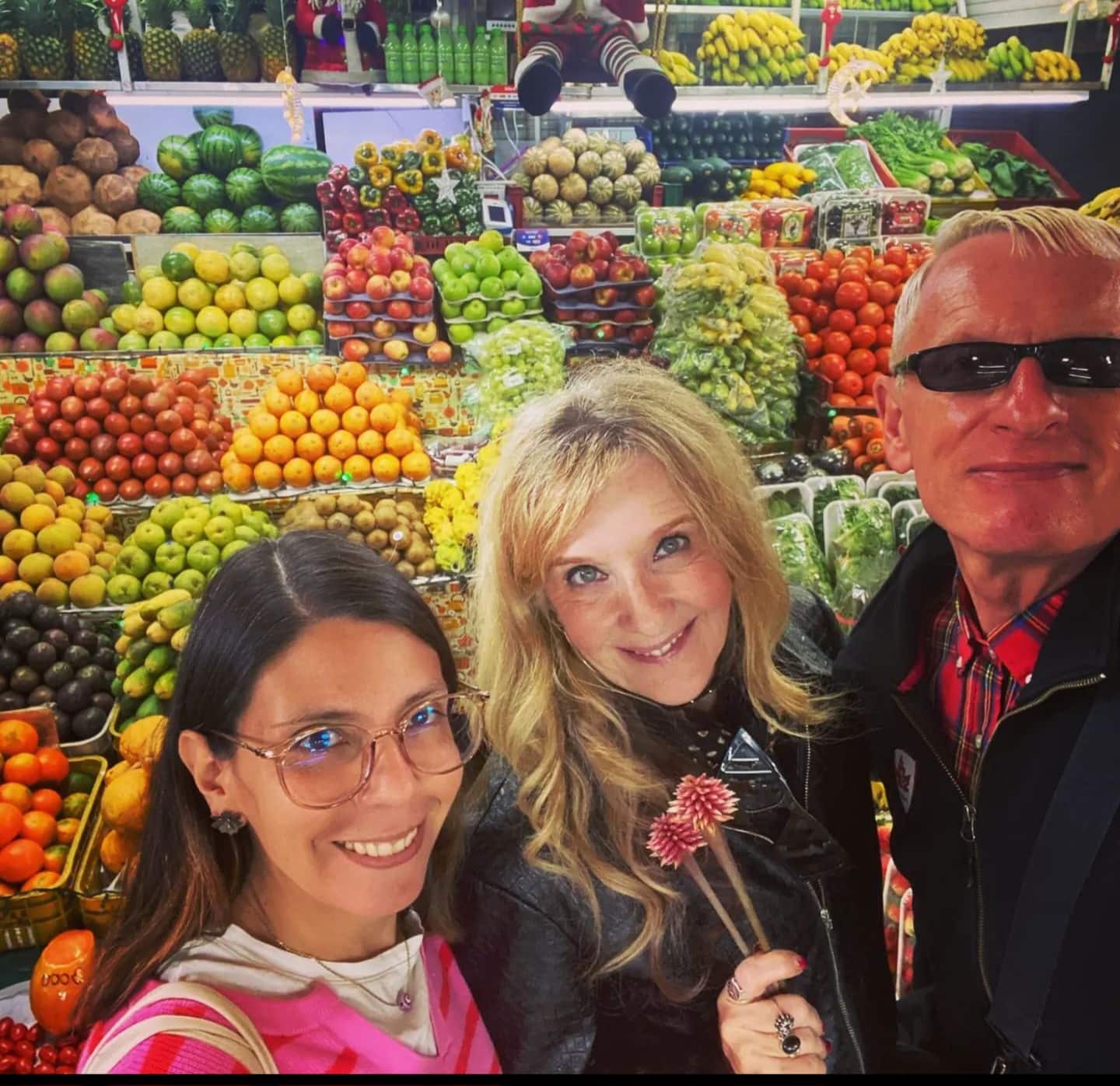 three people in a food market