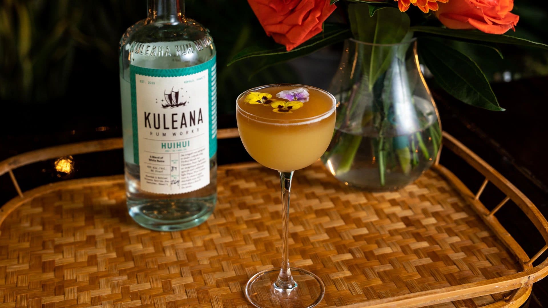 Kuleana Huihui Rum bottle with cocktail