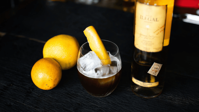 cocktail garnished with oranges