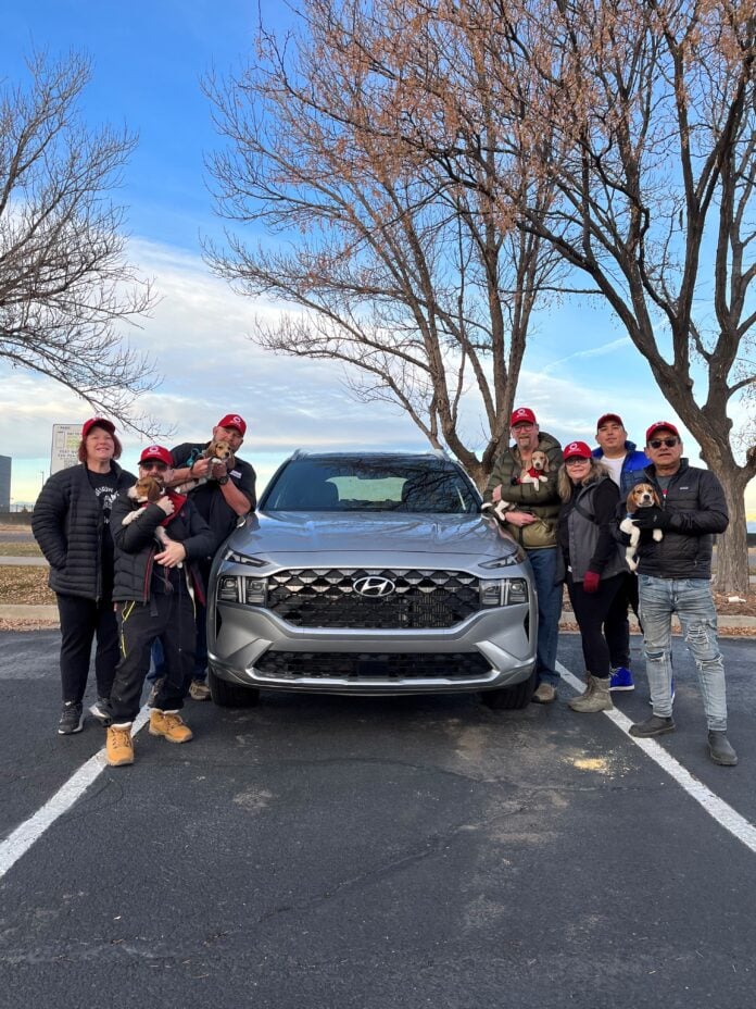 Hyundai Santa Fe With people holding beagles