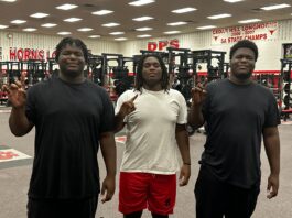 three black male athletes that are triplets