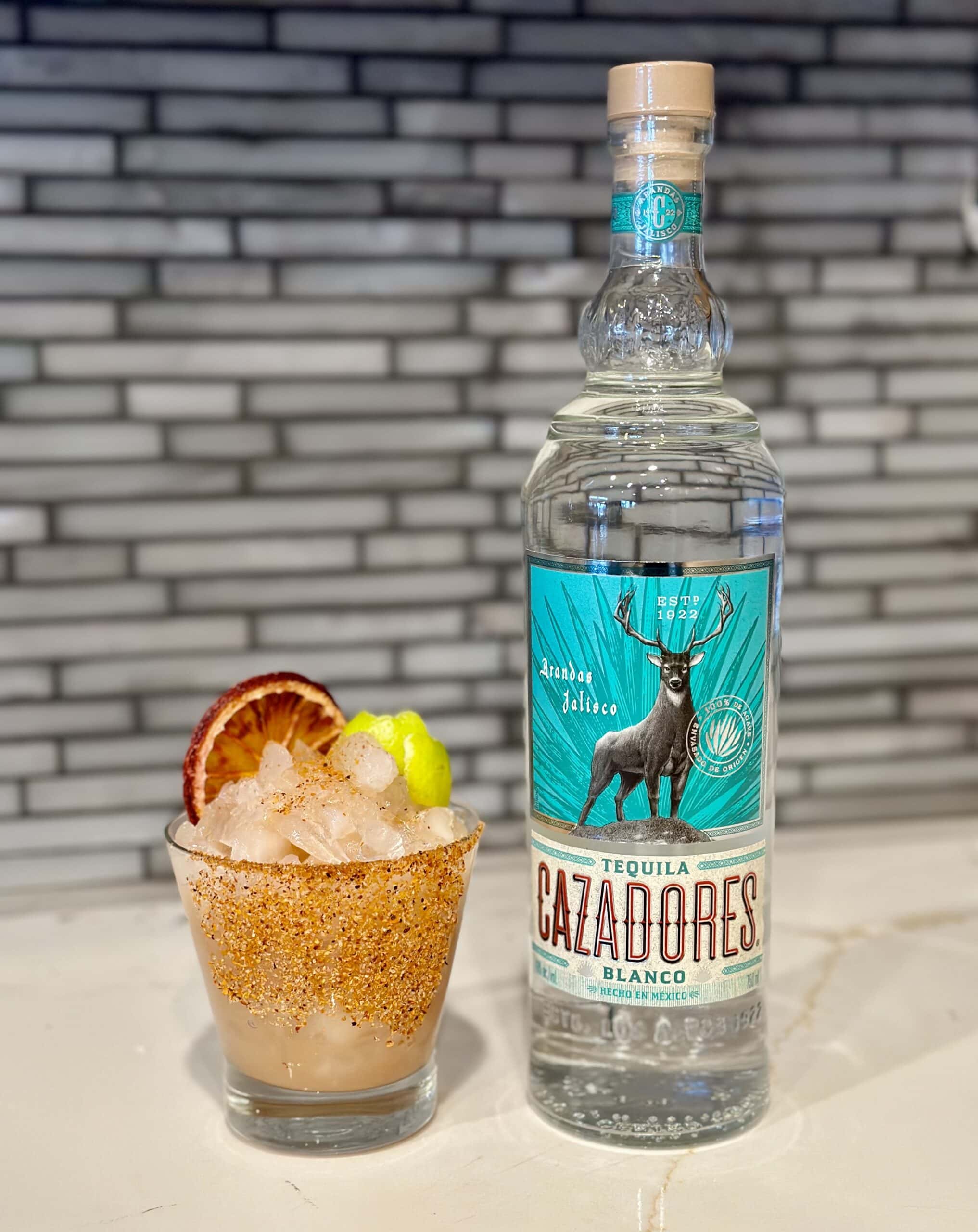 Cazadores blanco tequila bottle and margarita with tamarind